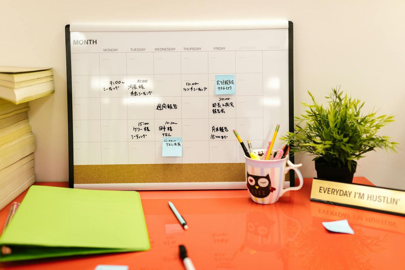 Desk calendar, sticky notes, and stationery flat lay representing planning and coordination (Pexels stock by RDNE Stock project).