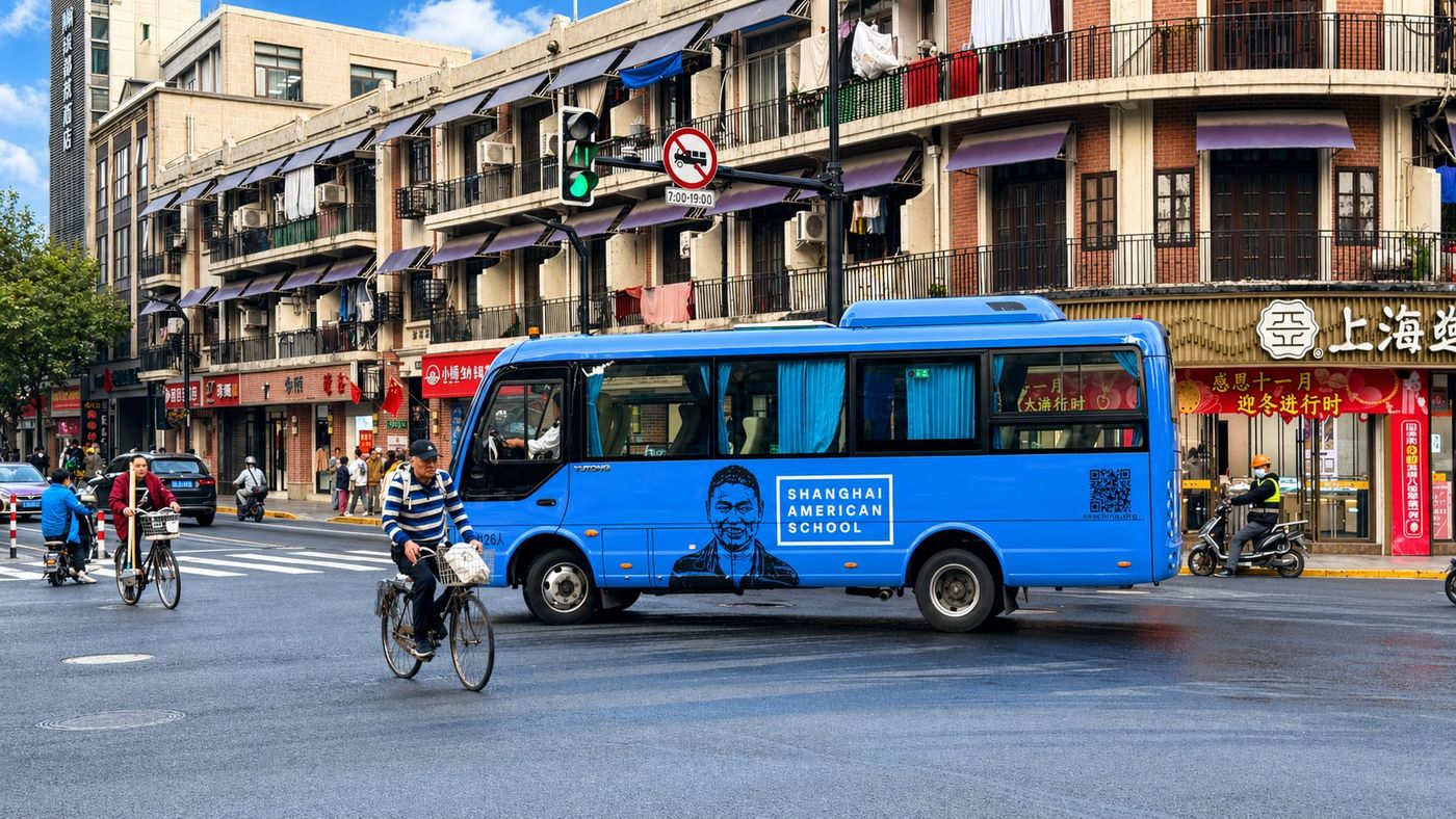 Shanghai international school bus pulling out of a residential compound — why school choice should drive neighborhood